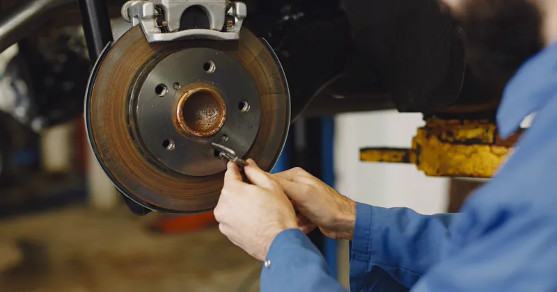 Mechanic working on a brake disc