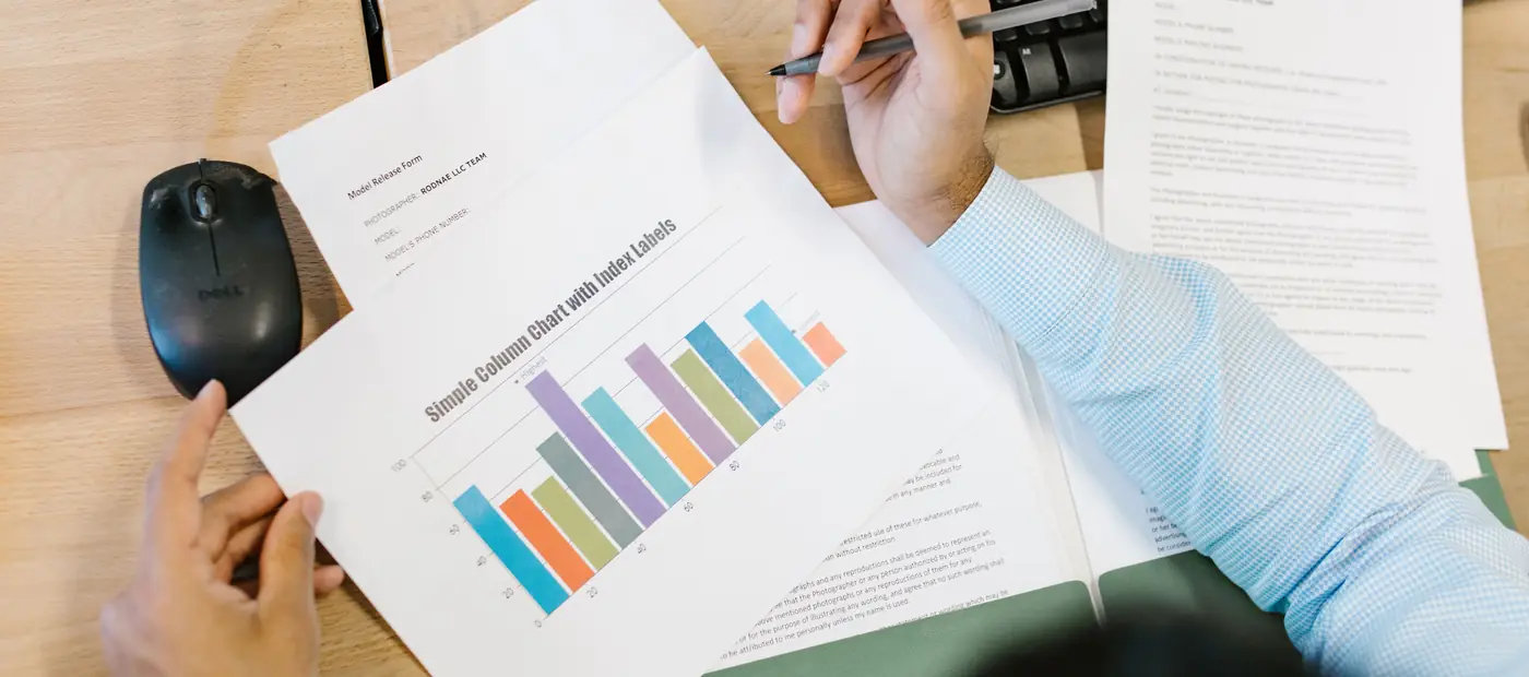 A printed chart being reviewed at a desk
