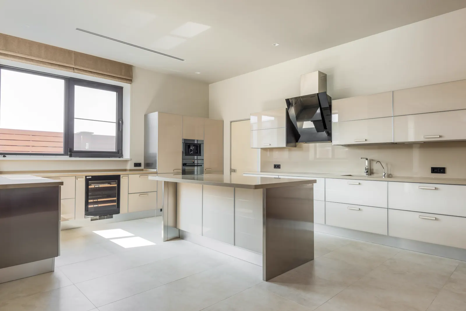 Clean kitchen with a built-in oven.