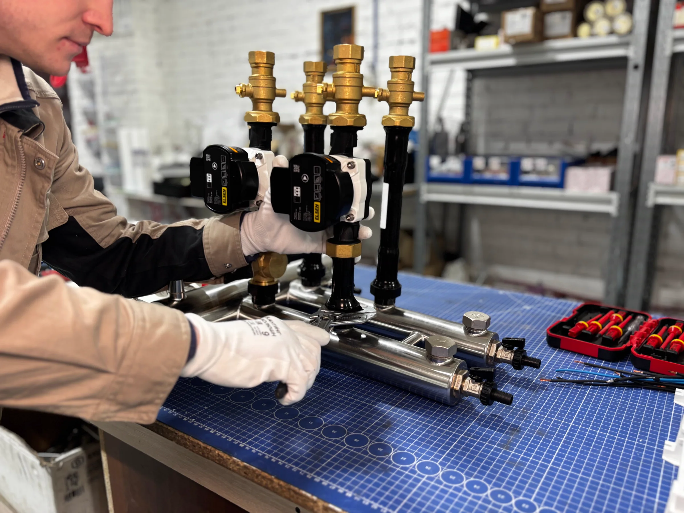 Engineer assembling a heating unit
