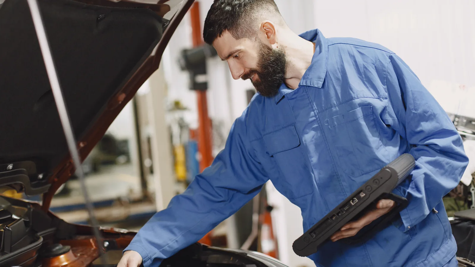 Mechanic using a diagnostic tool